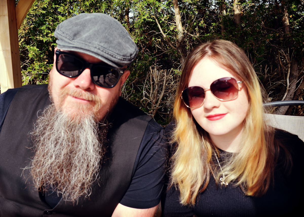Chris & Lavinia in black tops and sunglasses